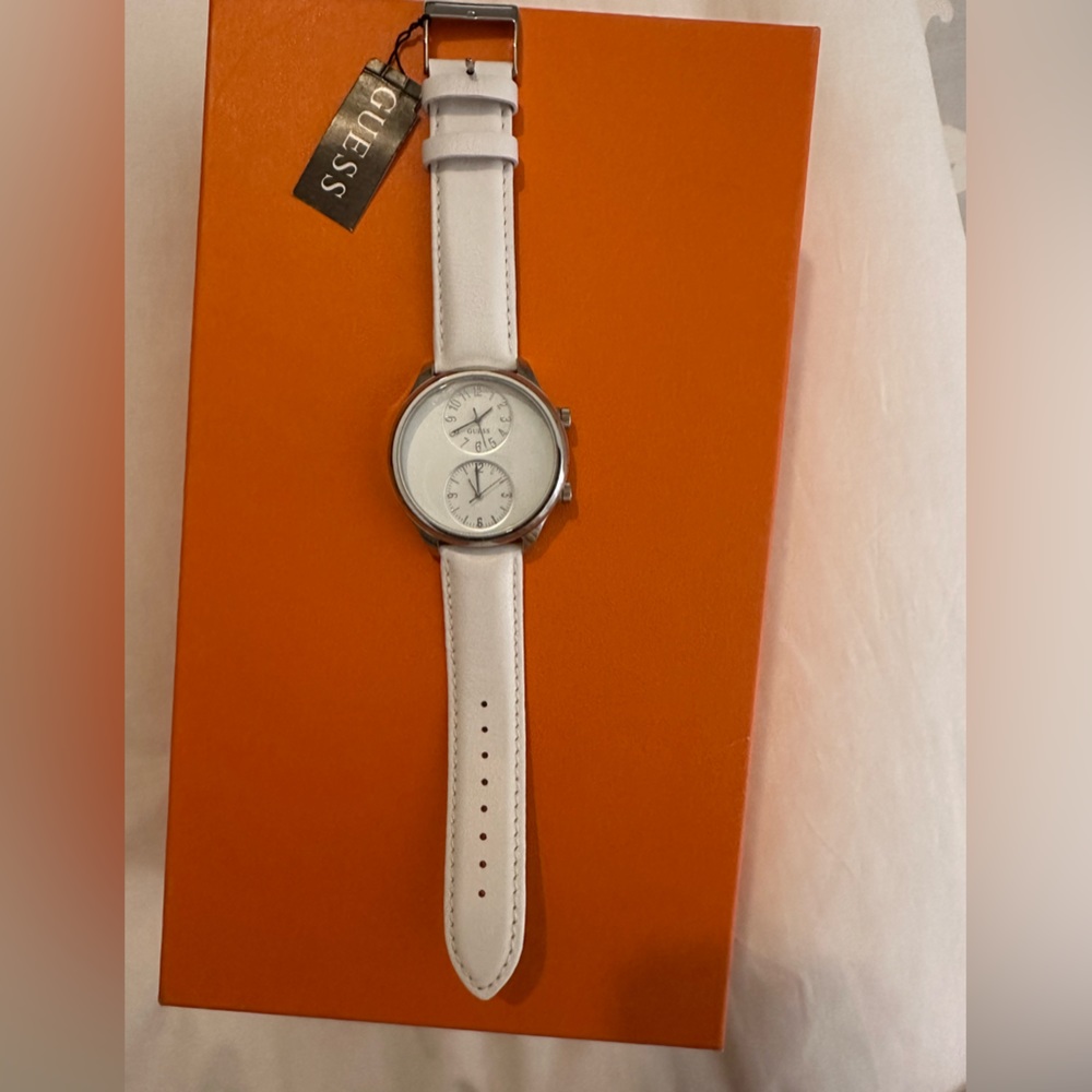 Silver double face Guess watch with white leather strap
